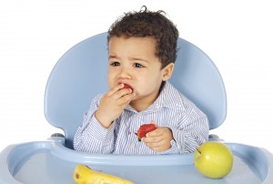 bigstock-Adorable-Baby-Eating-Fruit-1874493