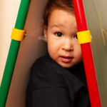 Child Hiding in Calkboard space - may have sensory processing disorder