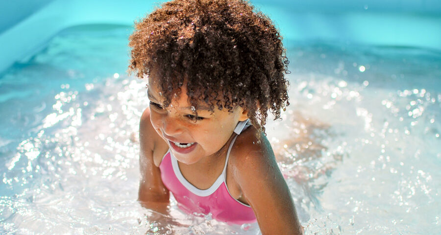 toddler splashing in water