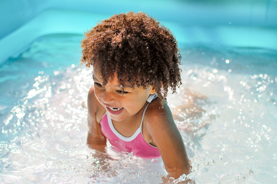 toddler splashing in water