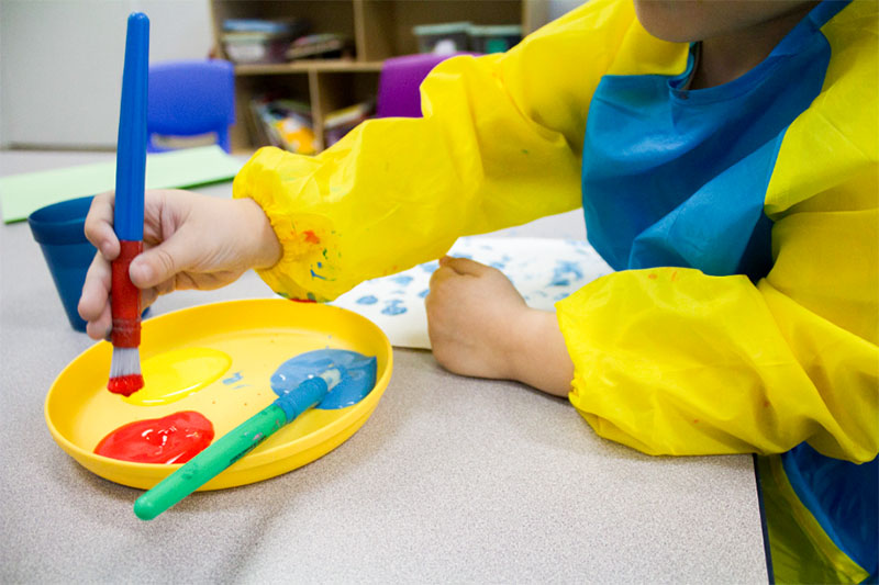 Child painting at ABA
